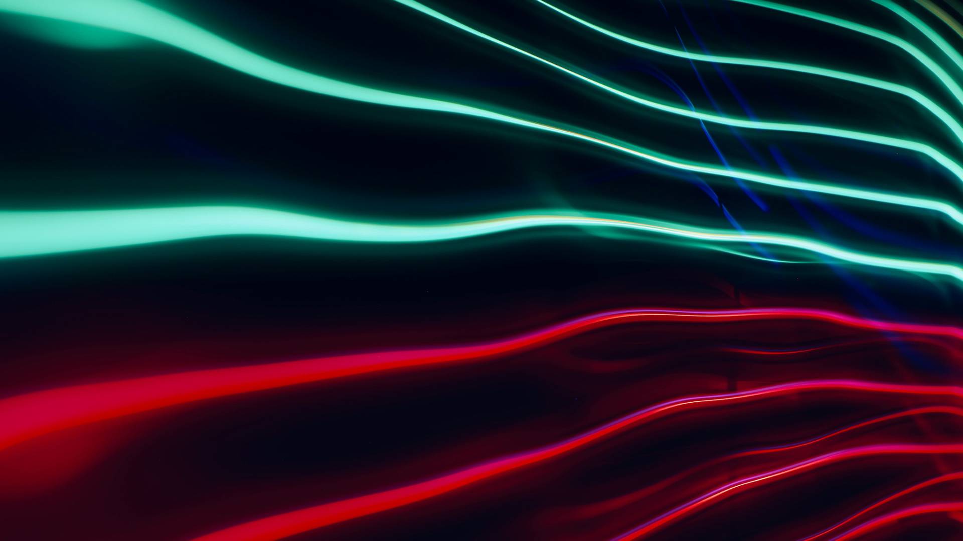 Graphic with abstract lines of light - green at top, red below - on a black background