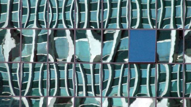 section of building exterior with windows and glass